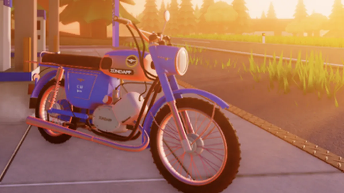 The engine case and low chrome exhaust of a blue Simson S51, the parts Jlows Tuning-Werkstatt actually works on